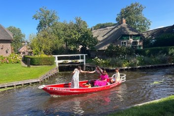 a group of people in a boat with holland experience tour